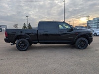 The 2026 Ram 2500 Limited Mega Cab Night Edition in Diamond Black Crystal Pearl delivers bold stylin... (image 7)