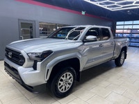 The 2025 Toyota Tacoma SR5, clad in a refined Silver finish, is ready to tackle any terrain with its... (image 4)