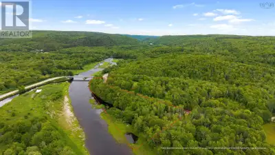 This exceptional 3.5 acre property offers more than 1,000 feet of frontage along the sought-after We...