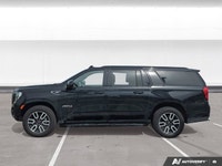 Experience the premium capability and rugged refinement of the 2023 GMC Yukon XL AT4. This used full... (image 2)