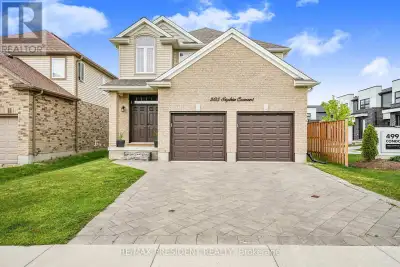 Spacious open-concept main floor featuring 9' ceilings, a huge living room with large windows and el...