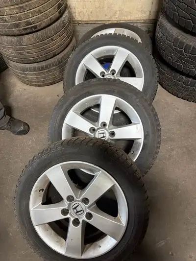 Set of 4 Honda OEM alloy rims with winter tires for sale. Details: * Genuine Honda rims * 16 inch *...