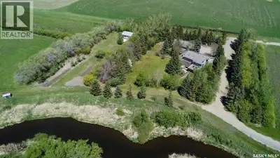 Located in the Condie Area, 29.38 acres, only 11 miles from Regina. Stunning water front walkout bun...