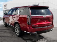The 2021 Cadillac Escalade includes a panoramic sunroof, power-retractable running boards, hands-fre... (image 2)