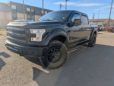 The 2017 Ford F-150 in stunning black is a robust 44 truck that excels in handling and performance....