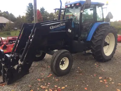 NH TM115 Tractor with Cab & Air conditioning. Quickie Loader. 2 Wheel drive. Turns short and lifts h...