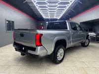 The 2025 Toyota Tacoma SR5, clad in a refined Silver finish, is ready to tackle any terrain with its... (image 2)