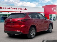 Elevate your daily drives in the 2025 Mazda CX-5 GT Sport Utility, resplendent in captivating Red. T... (image 6)