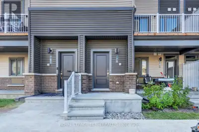 This impeccably designed 2-bedroom, 3-bathroom stacked townhome (2025 built - almost brand new) bala...