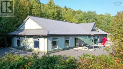This charming bungalow is nestled on a private 5-acre lot, offering the perfect blend of sustainable...