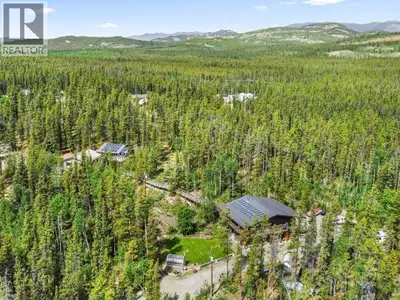 Discover an exceptional Yukon estate on 10 private acres along prestigious Hot Springs Area. Blendin...