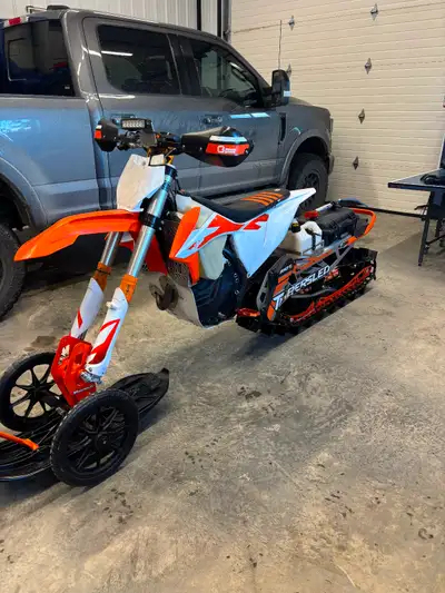 Ktm 450 snowbike with 2022 timber sled riot kit on it. 88 hours Has all the snowbike parts C3 heated...