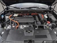 The 2025 Black Honda CR-V Hybrid Touring AWD is your gateway to balanced power and superior handling... (image 5)