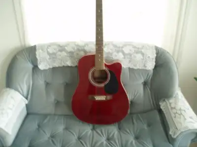 Acoustic guitar . Made by Rose. Beautiful guitar with cut out. Great sound. Length is 41’’. Selling...