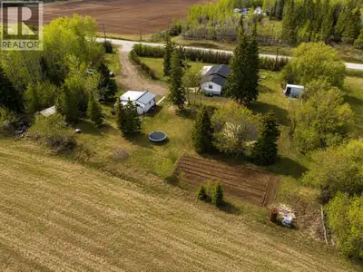 This 5 acre acreage is located right on Hwy 697 with pavement right to your property. The home featu...