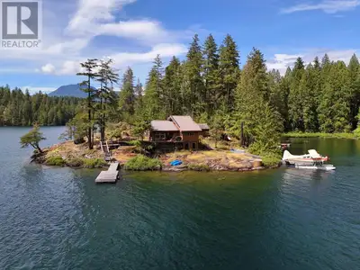 Offered for the 1st time in generations, this incredibly rare low-bank trophy property on West Lake,...
