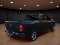The 2022 Ram 1500 Classic SLT 4x4 Crew Cab in striking black is the perfect combination of power and... (image 5)