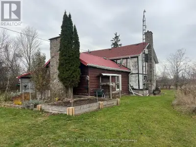 150-year-old two-storey log farmhouse set on 99 scenic acres, including approximately 60 acres of wo...