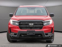 Introducing the 2026 Honda Ridgeline Black Edition AWD, a stunning red truck designed for those who... (image 1)