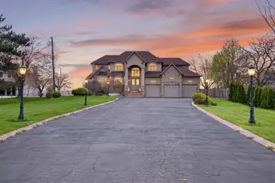 Welcome to 803 Ridge Road, an extraordinary custom-built estate set on a private 0.81 acre escarpmen...