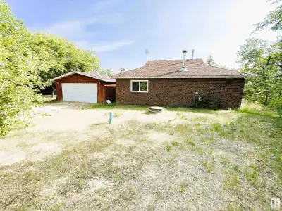 Welcome to your charming lakefront retreat just steps from the serene waters of beautiful Moose Lake...