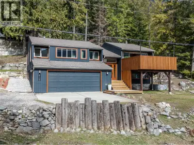 Resting on the hillside near the shores of Kootenay Lake, this beautifully renovated home strikes th...