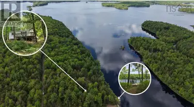 Welcome to 125 Cottage Lane Your Summer Escape on Ponhook Lake Tucked away among the trees and offer...