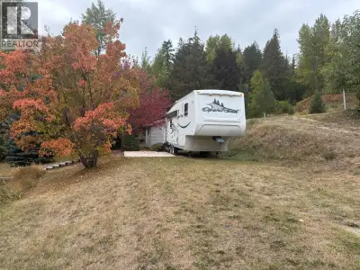 Lake & Mountain View Lot in Whisper Mountain – RV Use Grandfathered In! Welcome to your own slice of...