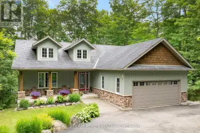 Top 5 Reasons You Will Love This Home: 1) Set on a spectacular half-acre treed lot, this property of...