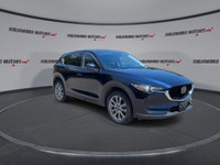 Finished in blue with a black interior, this used 2021 Mazda CX-5 GT AWD brings together upscale com... (image 1)