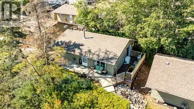 This charming LAKEFRONT detached four season cottage in the sought after community of Whispering Pin...