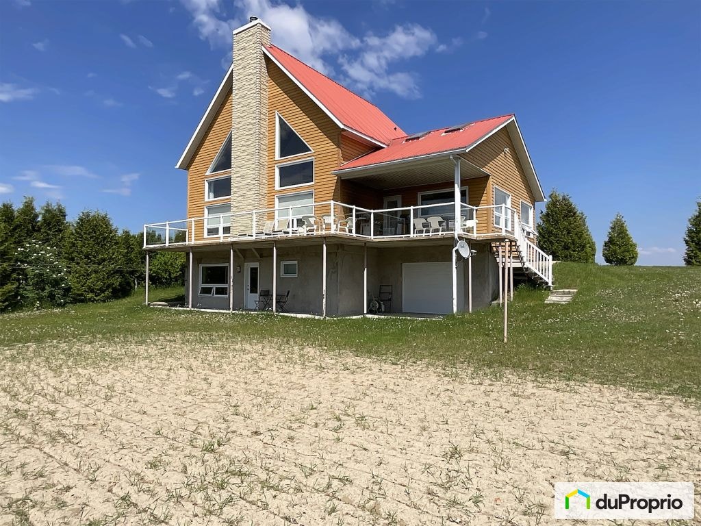 $749,000 - Cottage for sale in Chambord — photo 1