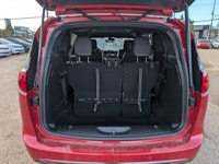 The 2026 Chrysler Grand Caravan SXT in Red Hot Pearl with a Black interior offers a bold look, spaci... (image 5)