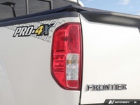 Ready for any adventure or workday, this 2018 Nissan Frontier Crew Cab Pickup in striking Glacier Wh... (image 7)