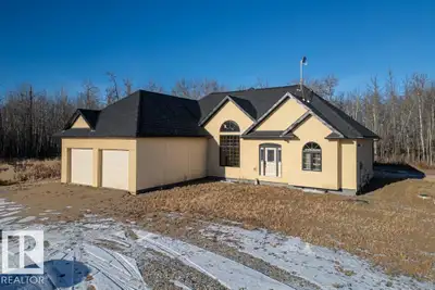 Discover 72 acres of peaceful PRIVACY with this beautifully crafted bungalow offering over 1,800 sq....