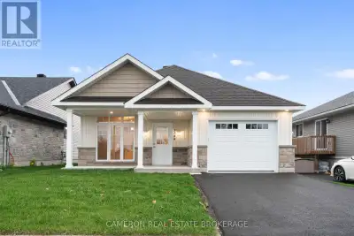 SIMPLIFIED LIVING AT IT'S BEST! Check out this brand new ground level entry bungalow with front + re...