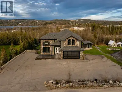 One of Charlie Lake’s most impressive semi-custom residences – a striking home that blends modern el...