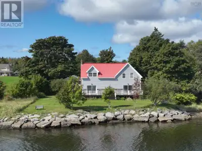 Experience the pinnacle of waterfront living. With its iconic red roof perched along Sunrise Drive,...
