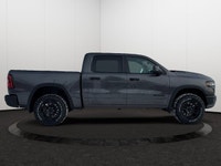 This 2026 RAM 1500 REBEL CREW CAB 4X4 has the following options Lux Leather Trimmed Bucket Seats, Re... (image 5)