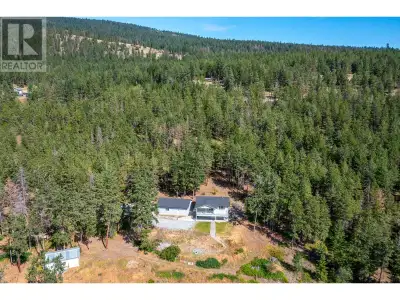 Tucked away in complete privacy, this stunning 12 acre forested property offers unmatched serenity a...