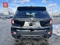 Conquer every adventure with the rugged yet refined 2023 Honda Passport TrailSport, a vehicle engine... (image 5)