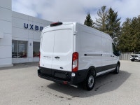 Focused on practicality and economy, this Ford Transit is a strong contender in the work van market.... (image 4)