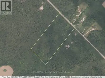 Experience the beauty and tranquility of this expansive 23-acres property, ideally located on a pave...