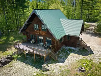 Gorgeous waterfront log home on nearly 2 acres. This property is located on the Coulonge River, with...