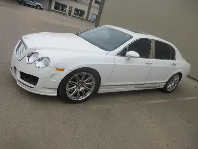 V12 TWIN TURBO CHARGED 552HP engine. AWD. ZF 6 spd aut. Triptonic black leather. 12 speakers. 19" AL...