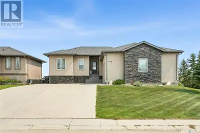 Exceptional Walkout Bungalow with Waterfront Views in Humboldt’s Most Sought-After Location! This st...