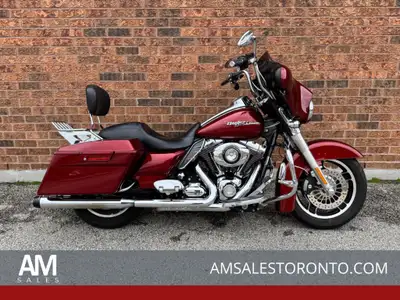 Beautiful Canadian Street Glide with Rinehart pipes, custom handlebar with heated grips, Willy G mir...