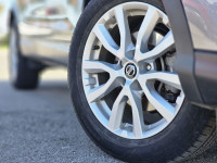 The 2023 Nissan Qashqai SV in a striking color, equipped with an automatic transmission and an all-w... (image 6)