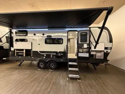 This lightweight trailer features 2 double wide bunk beds, a large u-shaped dinette, and a murphey b...