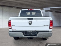 This commanding 2023 Ram 1500 Classic SLT Crew Cab Pickup, shimmering in Bright White with a functio... (image 5)